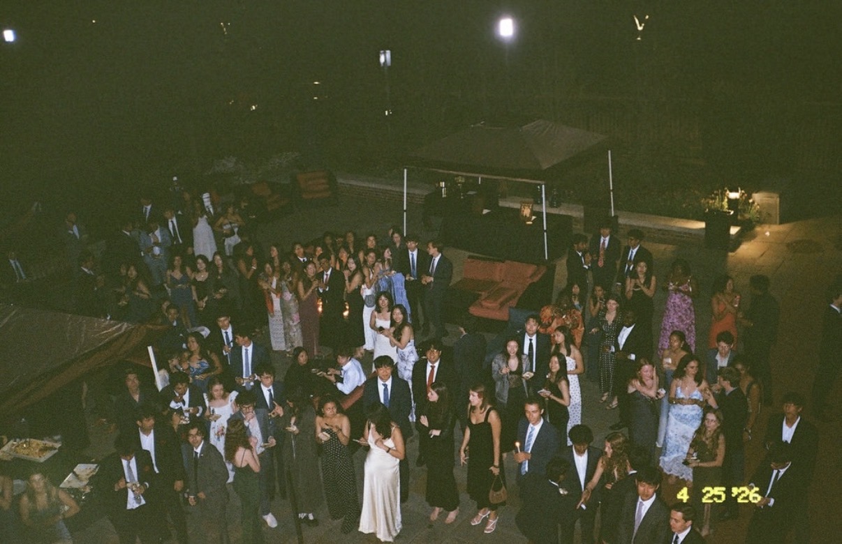 Cap and Gown members at a club formal